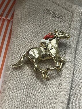 Vintage “Gerrys” Gold-tone Horse & Jockey Pin with Red and White Accents